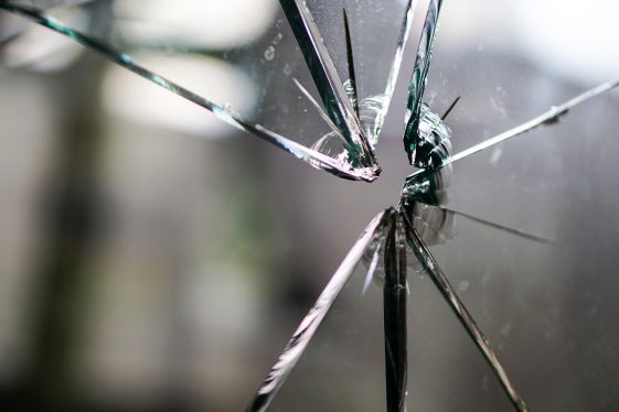 Broken glass pane depicting damage from narcissism